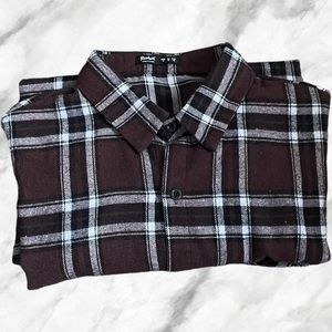 This is a Striped Brown Button Up Size Medium in Men